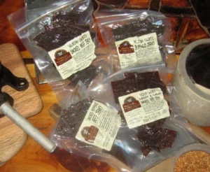 Hermann Wurst Haus Jerky on a table in a vacuum bags