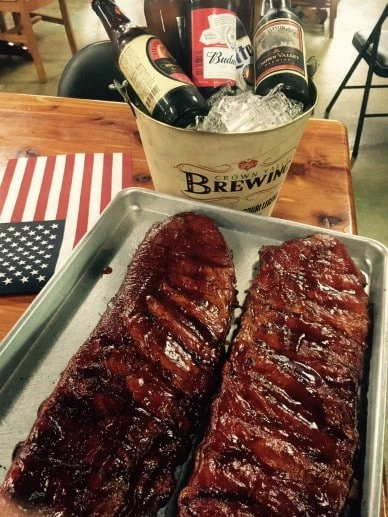 Roasted ribs with craft beer on a table