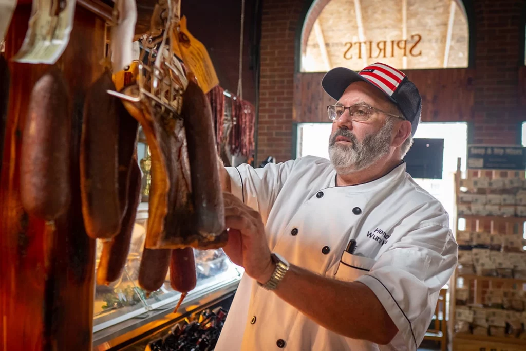 Mike Wurstmeister selling smoked meat in Hermann Wurst Haus Restaurant
