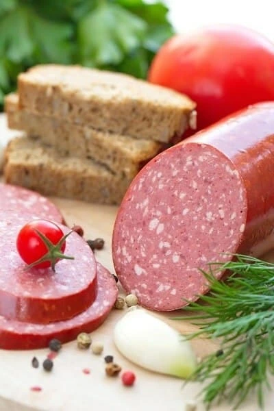 Sliced Summer Sausage Bologna with tomatoes and garlic