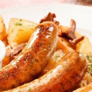 Sausages with potatoes on a plate
